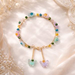 Colorful butterfly charm bracelet with floral beads and gold chain for women by Sawi Jewellery
